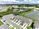 Scenic aerial view of the community, highlighting ponds and neatly arranged townhomes at 1067 Plantation Ln, Davenport, FL 33896