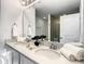 Bathroom featuring dual vanities, ample counter space, and modern fixtures at 1067 Plantation Ln, Davenport, FL 33896