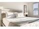 Bedroom featuring a large bed with a stylish gray blanket and pillow at 1067 Plantation Ln, Davenport, FL 33896