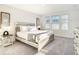 Sun-drenched bedroom with soft carpeting and decorative wall accents at 1067 Plantation Ln, Davenport, FL 33896