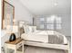 Bright bedroom with three windows and decorative wall art for added appeal at 1067 Plantation Ln, Davenport, FL 33896
