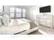 Serene bedroom with bright light, a dresser, and a television at 1067 Plantation Ln, Davenport, FL 33896