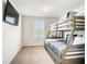 bedroom with a bunk bed and a mounted TV for entertainment at 1067 Plantation Ln, Davenport, FL 33896