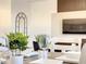 Tastefully decorated dining area blends seamlessly with living space and features a modern decor with neutral tones at 1067 Plantation Ln, Davenport, FL 33896