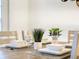 Charming dining table with elegant place settings, perfect for intimate meals and gatherings in a cozy space at 1067 Plantation Ln, Davenport, FL 33896