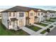 Modern townhomes with neat landscaping, driveways and beautiful exteriors at 1067 Plantation Ln, Davenport, FL 33896