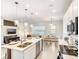 Modern kitchen with stainless appliances and a view of the living and dining areas at 1067 Plantation Ln, Davenport, FL 33896