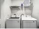 Laundry room equipped with Samsung washer and dryer and shelving for storage at 1067 Plantation Ln, Davenport, FL 33896