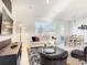 Bright living room and dining area with modern furnishings and lots of natural light at 1067 Plantation Ln, Davenport, FL 33896