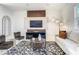 Stylish living room with a cozy sofa, decorative rug, modern furniture, and a large wall-mounted television at 1067 Plantation Ln, Davenport, FL 33896