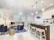 Open-concept living space featuring a modern kitchen island, dining area, and comfortable living room furnishings at 1067 Plantation Ln, Davenport, FL 33896