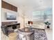 Bright and modern living area with stylish furniture, a large window, and contemporary decor at 1067 Plantation Ln, Davenport, FL 33896