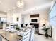 Open-concept living space integrating the dining area, kitchen, and living room for a seamless entertainment flow at 1067 Plantation Ln, Davenport, FL 33896
