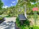 Community mini-golf course with rules sign, nestled in a lush landscape at 1067 Plantation Ln, Davenport, FL 33896