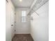 Clean walk-in closet with wire shelving and carpet at 1067 Plantation Ln, Davenport, FL 33896