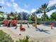 Community water park with a pirate ship and other water features surrounded by palm trees at 1067 Plantation Ln, Davenport, FL 33896