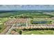 Aerial view of community with golf course, pool and playground at 1082 Blackwolf Run Rd, Davenport, FL 33896