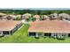 Expansive aerial view of a neighborhood featuring well-maintained lawns and diverse home styles at 1082 Blackwolf Run Rd, Davenport, FL 33896