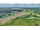 An aerial view shows a community with tile roof homes near golf course, lakes, and beautiful green spaces at 1082 Blackwolf Run Rd, Davenport, FL 33896