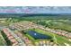 Aerial view of community with golf course in background and nearby theme parks at 1082 Blackwolf Run Rd, Davenport, FL 33896