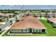 Aerial view of single-story home with well-kept landscaping in a scenic neighborhood at 1082 Blackwolf Run Rd, Davenport, FL 33896
