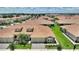 Beautiful aerial shot of a residential neighborhood with tile roofs and lush landscaping at 1082 Blackwolf Run Rd, Davenport, FL 33896