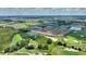 Aerial view of community near golf course, trees, and ponds at 1082 Blackwolf Run Rd, Davenport, FL 33896