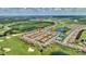 Beautiful aerial view of community near golf course, pond and amenities at 1082 Blackwolf Run Rd, Davenport, FL 33896