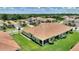 Scenic aerial view of a home with a tile roof, a screened-in lanai, and lush green landscaping at 1082 Blackwolf Run Rd, Davenport, FL 33896