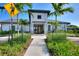 Modern clubhouse with landscaped walkway featuring accessible entrance, enhancing community appeal and convenience at 1082 Blackwolf Run Rd, Davenport, FL 33896