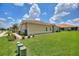 Charming single-story home featuring a well-maintained lawn and tile roof at 1082 Blackwolf Run Rd, Davenport, FL 33896