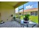 Peaceful screened lanai provides shade and a great view of the outdoors at 1082 Blackwolf Run Rd, Davenport, FL 33896