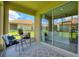 Relaxing screened lanai features comfortable seating and backyard views at 1082 Blackwolf Run Rd, Davenport, FL 33896