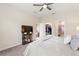Spacious main bedroom with ceiling fan, walk in closet, and en suite bath at 1082 Blackwolf Run Rd, Davenport, FL 33896