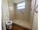 Bathroom featuring a tiled walk-in shower and easy-access grab bar at 116 Talavera Ln, Kissimmee, FL 34758