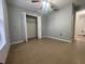 The bedroom includes tile flooring, a window for natural light, neutral walls, and a closet at 116 Talavera Ln, Kissimmee, FL 34758