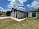 Single-story home with a well-maintained lawn and neutral exterior paint at 116 Talavera Ln, Kissimmee, FL 34758