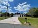 Charming single-story home featuring an attached garage and a well-manicured front yard at 116 Talavera Ln, Kissimmee, FL 34758