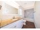 Bright bathroom features granite countertop vanity and shower-tub combination with decorative tile at 120 W Minnehaha Ave, Clermont, FL 34711