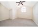 Bright bedroom with carpet, ceiling fan, and vaulted ceiling at 120 W Minnehaha Ave, Clermont, FL 34711