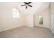Bright bedroom with carpet, ceiling fan, and vaulted ceiling at 120 W Minnehaha Ave, Clermont, FL 34711