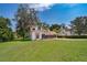 Charming two-story home with large front lawn, mature trees and two car garage at 120 W Minnehaha Ave, Clermont, FL 34711