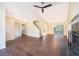 Spacious living room with fireplace and stairs, open to dining area at 120 W Minnehaha Ave, Clermont, FL 34711