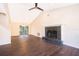 Spacious living room with fireplace, vaulted ceilings and backyard access at 120 W Minnehaha Ave, Clermont, FL 34711
