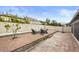 Inviting backyard featuring a brick patio with a fire pit and comfortable seating at 14160 Dove Hollow Dr, Orlando, FL 32824