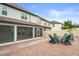 The backyard features a patio, seating and fire pit at 14160 Dove Hollow Dr, Orlando, FL 32824