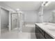 Clean bathroom features double vanity, shower, and soaking tub with decorative tile surround at 14160 Dove Hollow Dr, Orlando, FL 32824