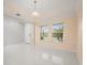Light filled living room with beautiful tile floors at 14160 Dove Hollow Dr, Orlando, FL 32824