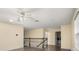 Open loft area features wood floors, natural light, and access to the laundry room at 14160 Dove Hollow Dr, Orlando, FL 32824