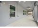 View of an outdoor patio with grey floor and walls at 14160 Dove Hollow Dr, Orlando, FL 32824